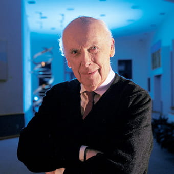 Watson posing in suit