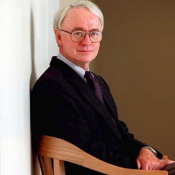 Wilson seated in chair