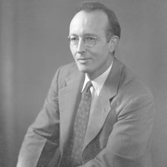 Mac Lane posing in a suit