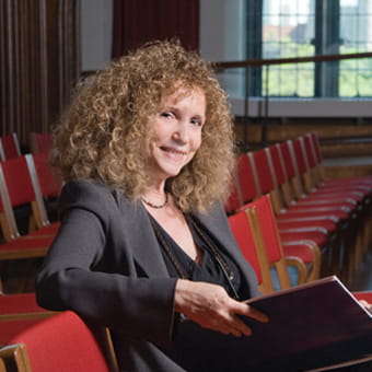 Ran smiling seated with book