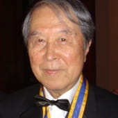 Nambu smiling in a tuxedo